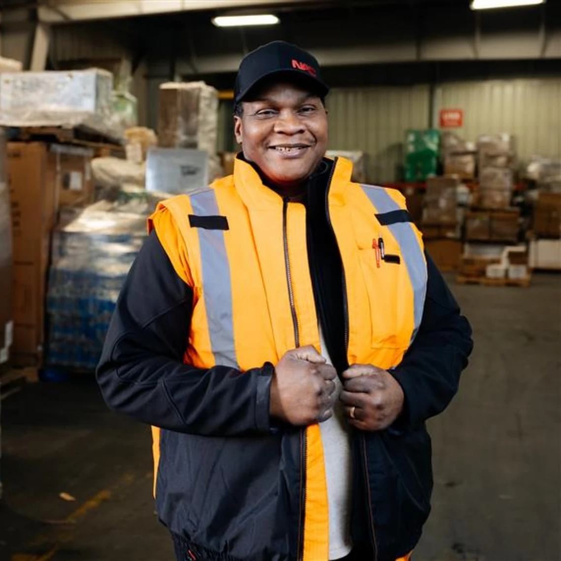 NAC Cargo Services Agent standing in the warehouse.