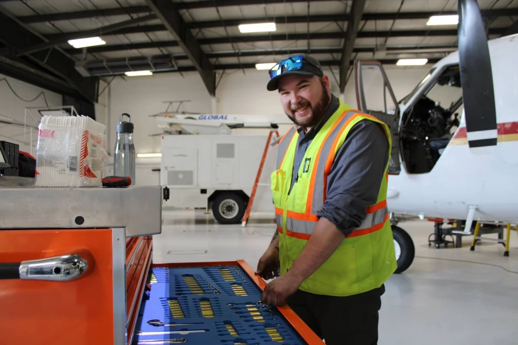 A NAMS employee opening a tool chest to take out a tool.