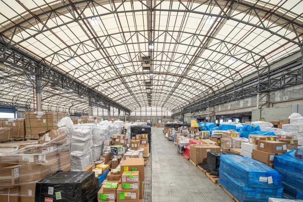 A wide shot of the StratAir warehouse filled with cargo pallets and boxes.