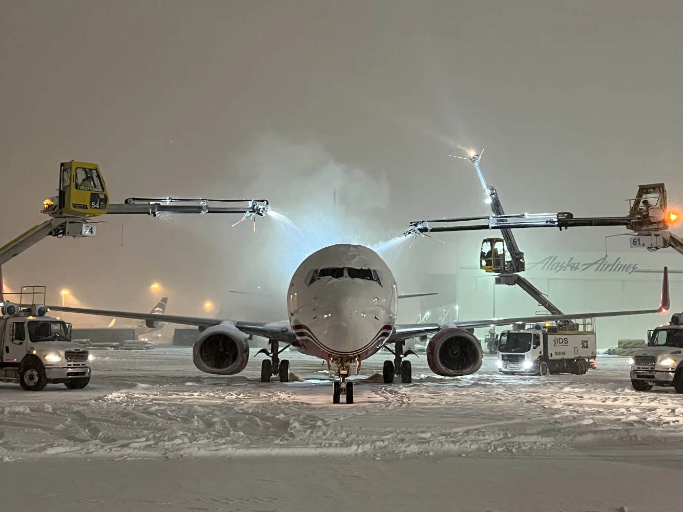 Photo of a NAC airplane being de-iced.